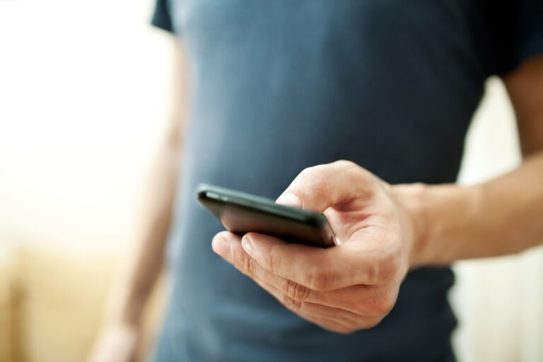 A close up of a person using a mobile phone