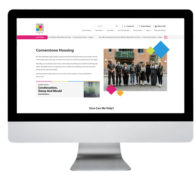 The Cornerstone Housing website homepage displayed on a desktop monitor