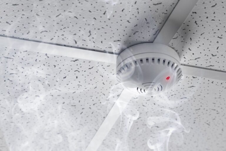 A smoke alarm fitted to a ceiling